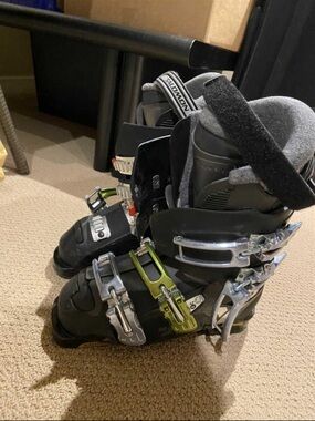 Salomon Black Ski Boots with Gray Liner and Yellow Buckle Accents
